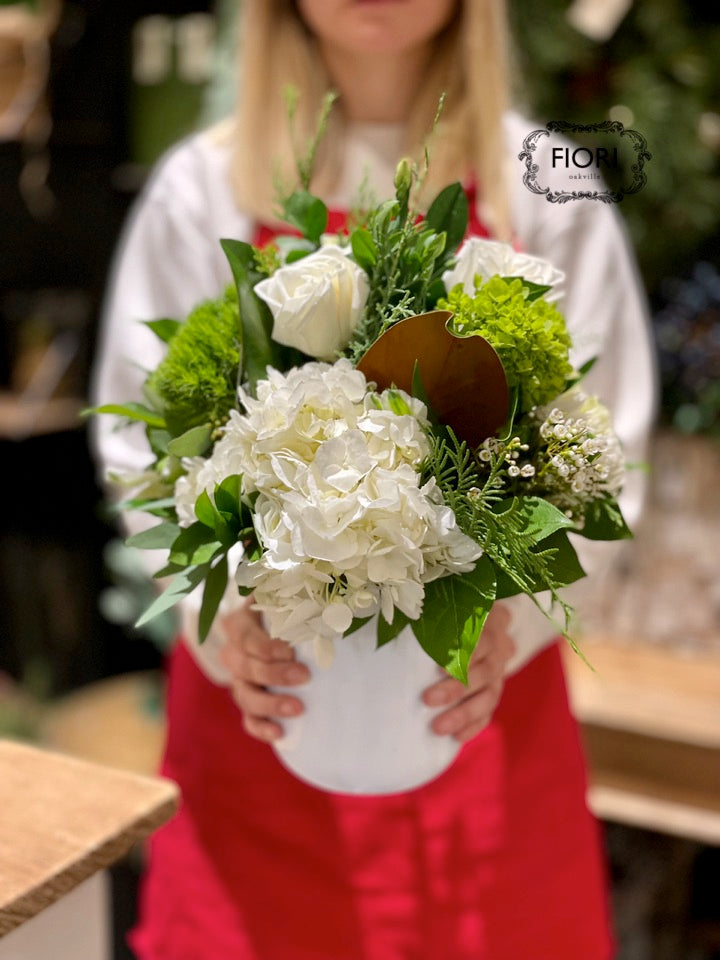 Winter White Beyond the Gloss Signature Floral Arrangement by FIORI Oakville, Oakville Florist in a Ceramic White Container